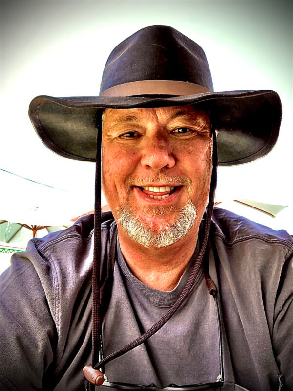Gene Scott in cowboy hat.